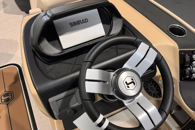 Slide: The Image of Steering wheel and dashboard of 2026 Harris Sunliner 250 boat with Simrad display. - 9