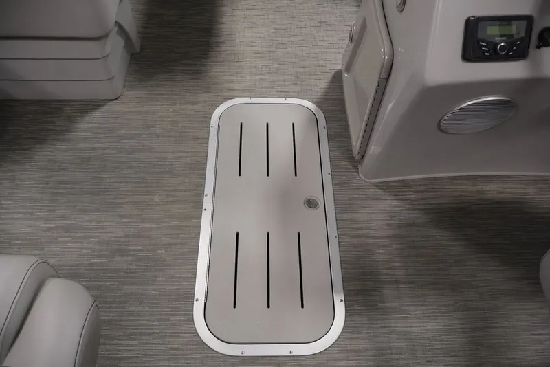 Slide: The Image of 2023 Bennington SV 22 Quad Bench interior with sleek flooring and storage compartment. - 27