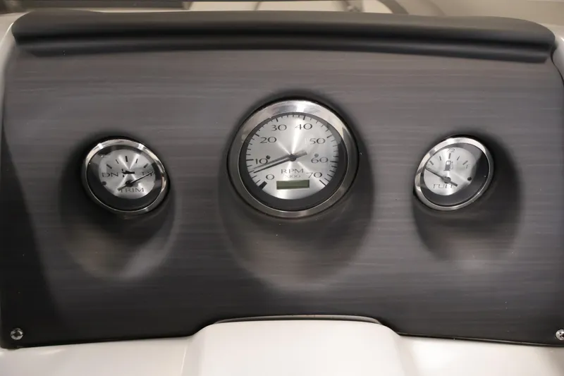 Slide: The Image of Dashboard of 2023 Bennington SV 22 Quad Bench with RPM, trim, and fuel gauges. - 21