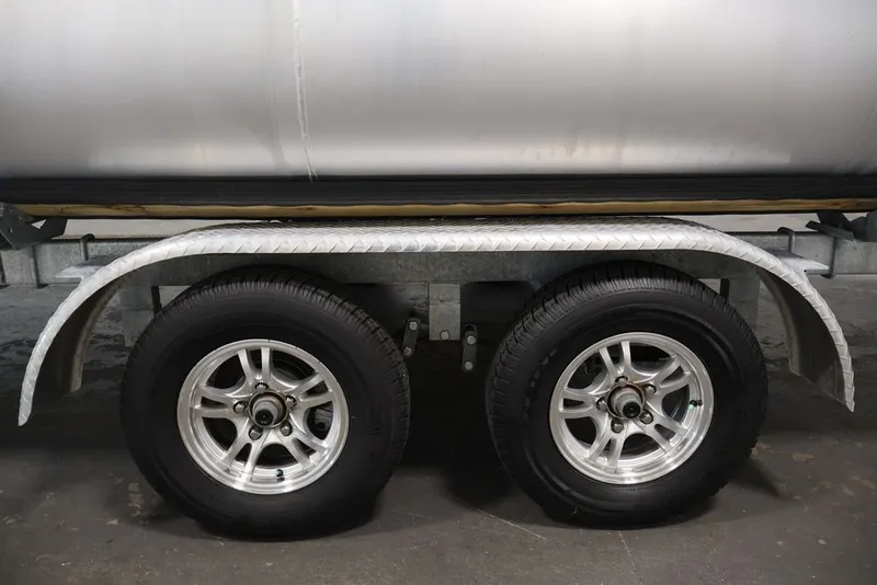 Slide: The Image of Trailer wheels of a 2023 Bennington SV 22 Quad Bench pontoon boat. - 34