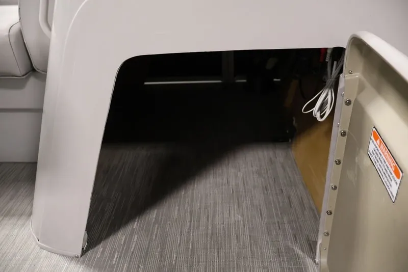 Slide: The Image of Interior view of 2023 Bennington SV 22 Quad Bench, showcasing under-seat storage area. - 26