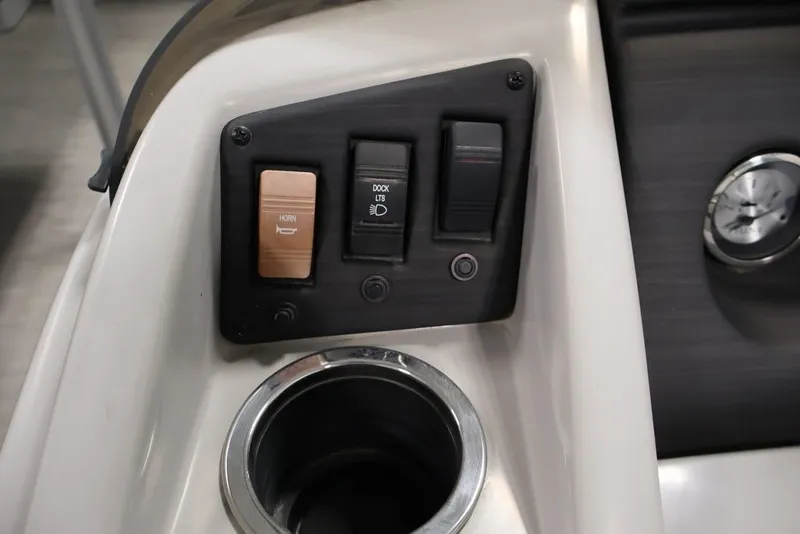 Slide: The Image of Control panel of 2023 Bennington SV 22 Quad Bench with horn and dock light switches. - 24