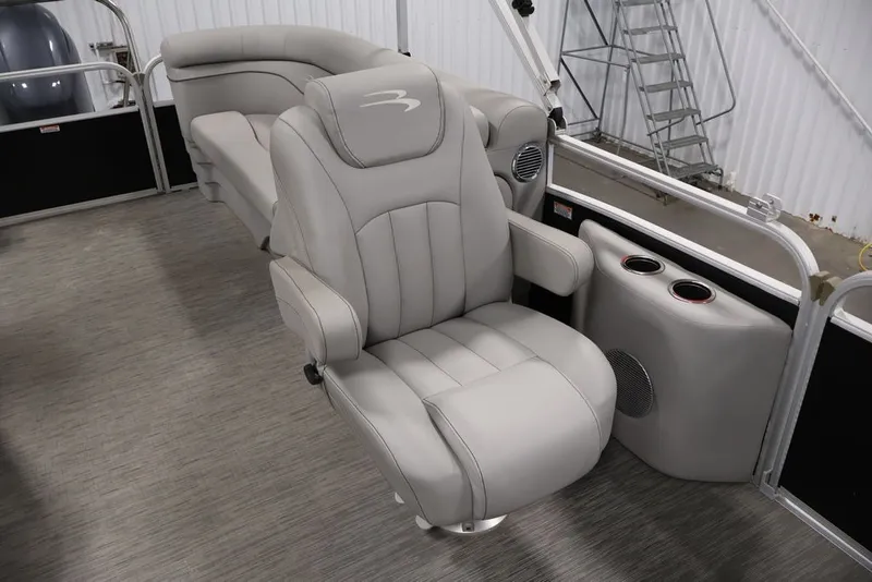 Slide: The Image of 2023 Bennington SV 22 Quad Bench interior with luxurious seating and cup holders. - 29