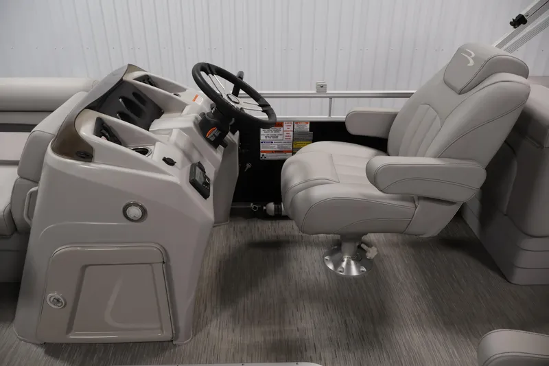 Slide: The Image of 2023 Bennington SV 22 Quad Bench boat interior with steering console and captain's chair. - 16