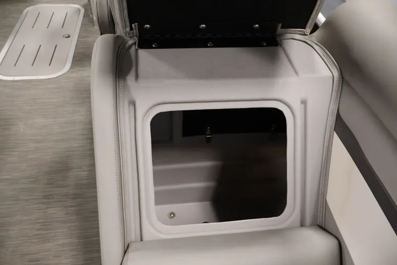 Slide: The Image of Open storage compartment in 2023 Bennington SV 22 Quad Bench boat interior. - 38