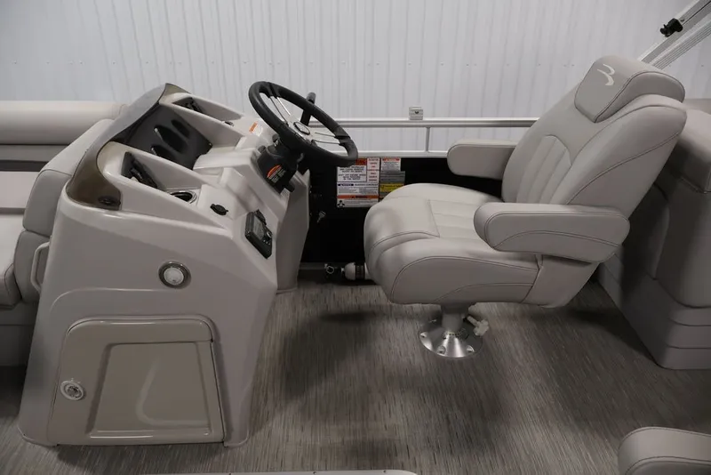 Slide: The Image of 2023 Bennington SV 22 Quad Bench interior with captain's chair and steering console. - 14