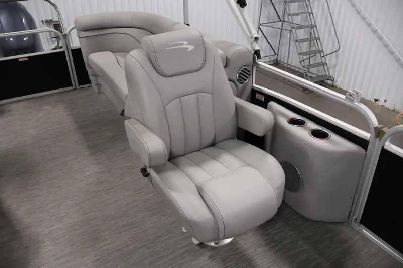 Slide: The Image of 2023 Bennington SV 22 Quad Bench interior with plush seating and cup holders. - 29