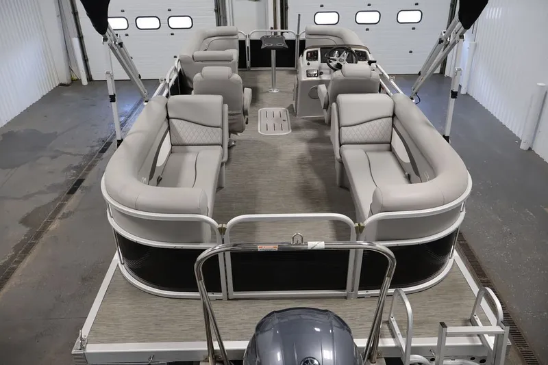 Slide: The Image of 2023 Bennington SV 22 Quad Bench pontoon boat with spacious seating in a showroom. - 16