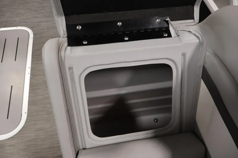 Slide: The Image of Open storage compartment in 2023 Bennington SV 22 Quad Bench boat seat. - 12