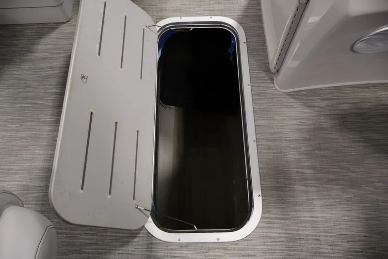 Slide: The Image of Open storage compartment on 2023 Bennington SV 22 Quad Bench boat. - 44