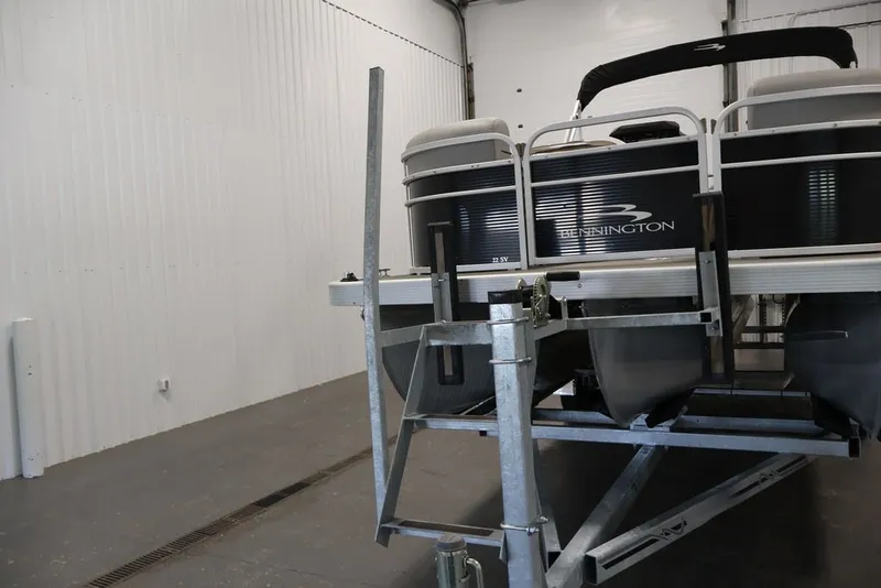 Slide: The Image of 2023 Bennington SV 22 Quad Bench pontoon boat on trailer in storage facility. - 37