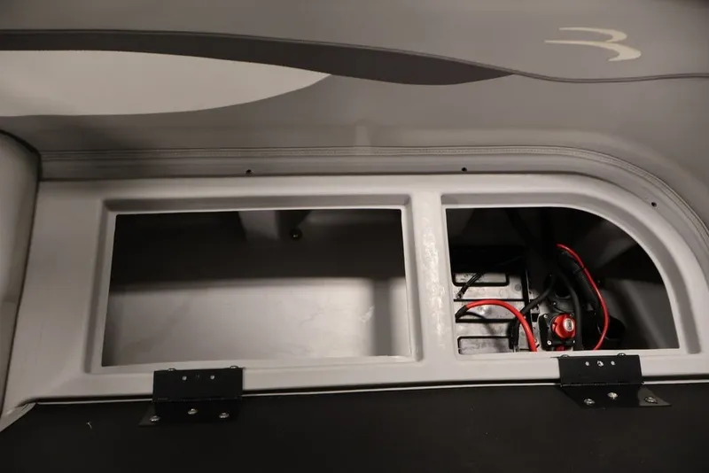 Slide: The Image of 2023 Bennington SV 22 Quad Bench storage compartment with wiring and battery setup. - 35