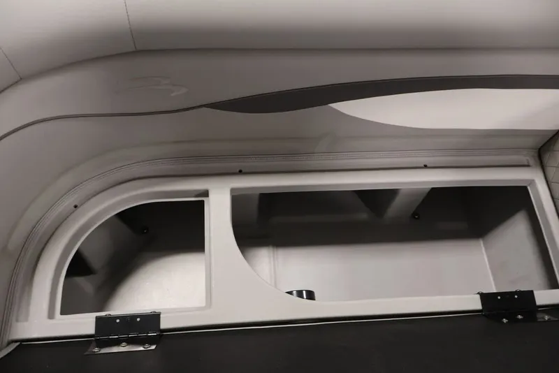 Slide: The Image of 2023 Bennington SV 22 Quad Bench storage compartment, showcasing spacious interior design. - 18