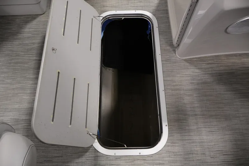 Slide: The Image of Open storage compartment on 2023 Bennington SV 22 Quad Bench boat. - 28