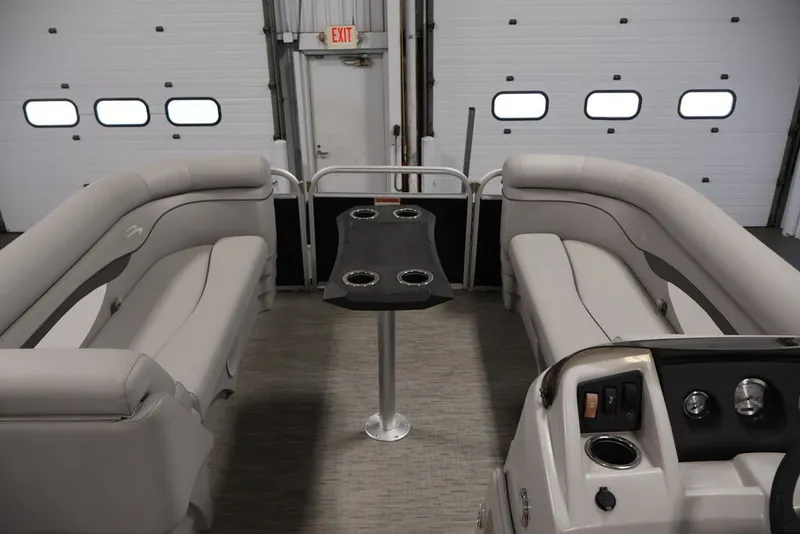Slide: The Image of 2023 Bennington SV 22 Quad Bench interior with plush seating and central table. - 13