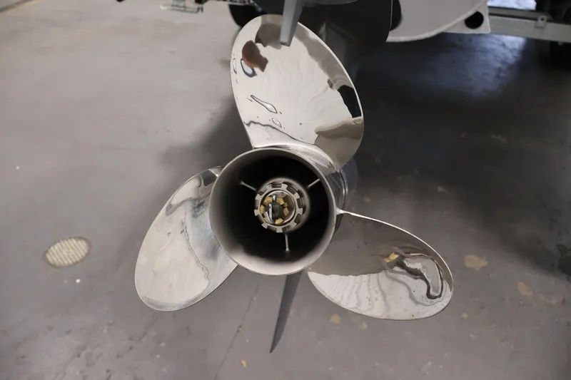 Slide: The Image of Close-up of a shiny boat propeller on a 2023 Bennington SV 22 Quad Bench. - 38