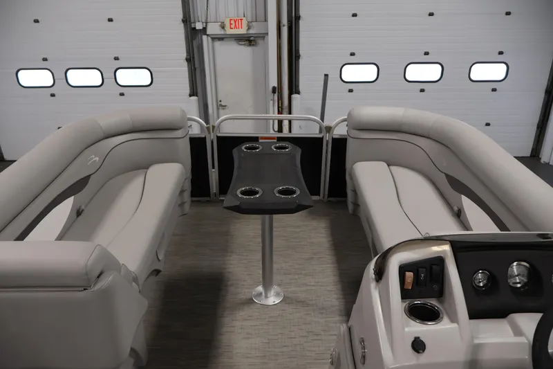 Slide: The Image of 2023 Bennington SV 22 Quad Bench interior with seating and table in a showroom. - 11