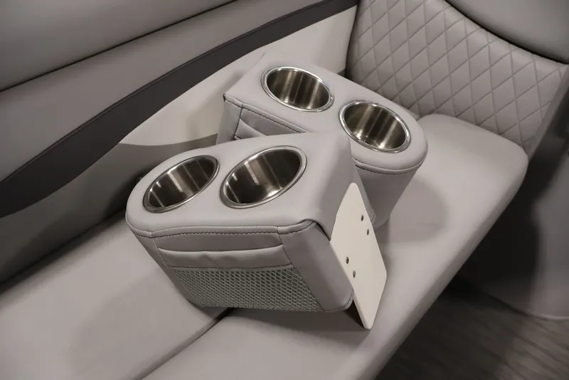 Slide: The Image of 2023 Bennington SV 22 Quad Bench with dual cup holders on gray seating. - 12