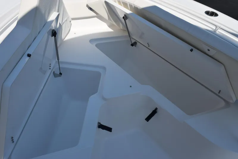 Slide: The Image of 2026 Sea Hunt Ultra 245 SE boat storage compartments, open and spacious design. - 17