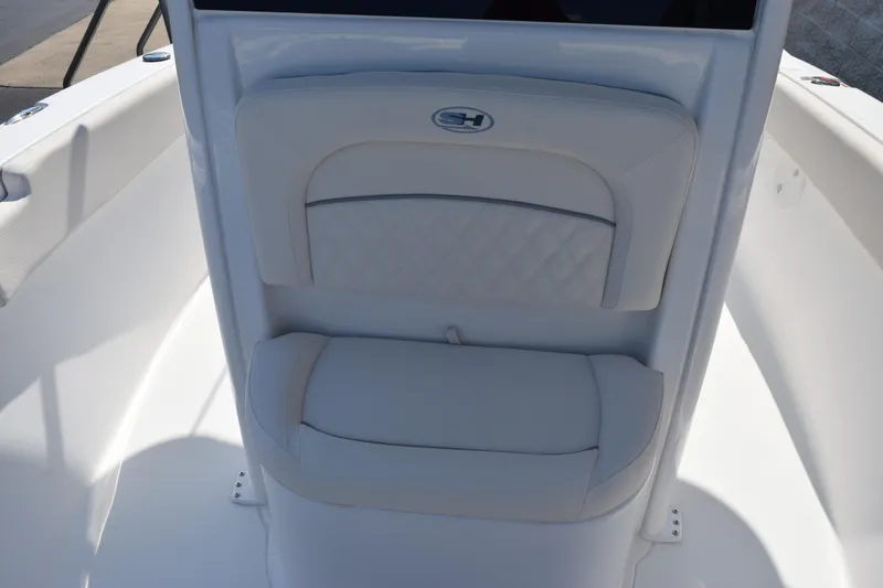 Slide: The Image of 2026 Sea Hunt Ultra 245 SE boat seat with white cushioned design. - 8