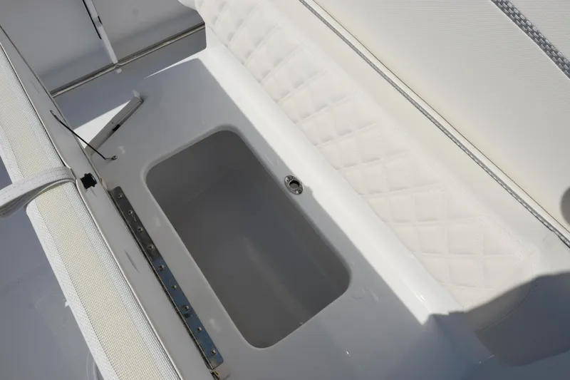 Slide: The Image of Interior view of 2026 Sea Hunt Ultra 245 SE boat's storage compartment. - 20