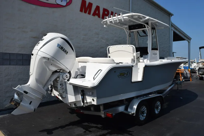 Slide: The Image of 2026 Sea Hunt Ultra 245 SE boat with Yamaha engine on trailer. - 4