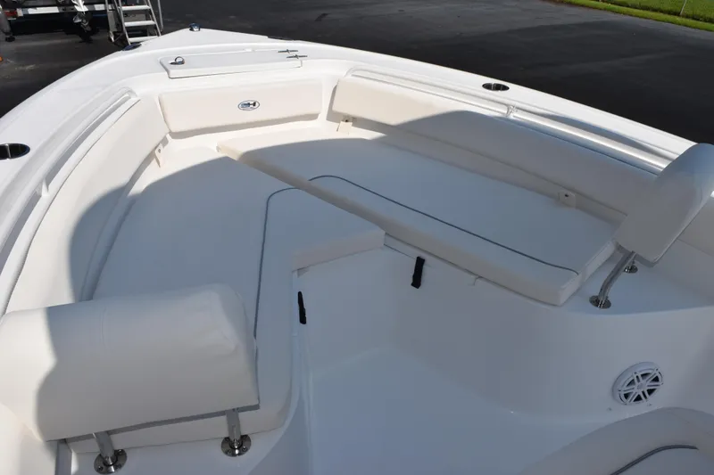 Slide: The Image of 2026 Sea Hunt Ultra 245 SE boat interior with cushioned seating and sleek design. - 7