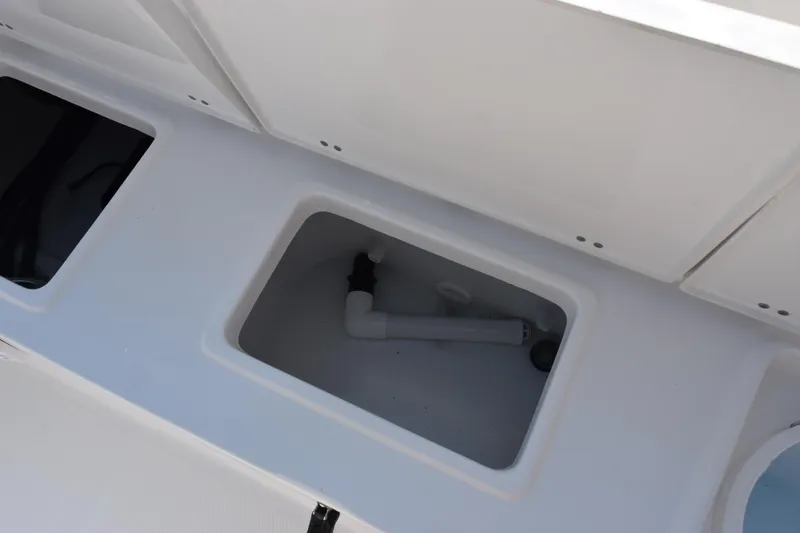 Slide: The Image of Storage compartment on 2026 Sea Hunt Ultra 245 SE boat deck. - 23