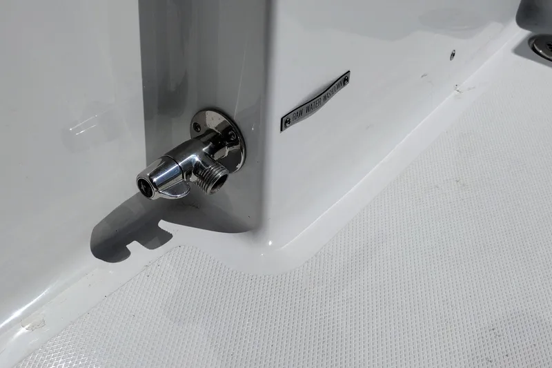 Slide: The Image of 2024 Wellcraft 223 Fisherman raw water washdown outlet on deck. - 31