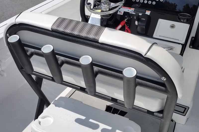 Slide: The Image of 2024 Wellcraft 223 Fisherman boat interior with rod holders and steering console. - 29