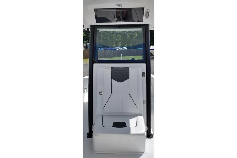 Slide: The Image of 2024 Wellcraft 223 Fisherman boat interior with seating and storage compartment. - 17