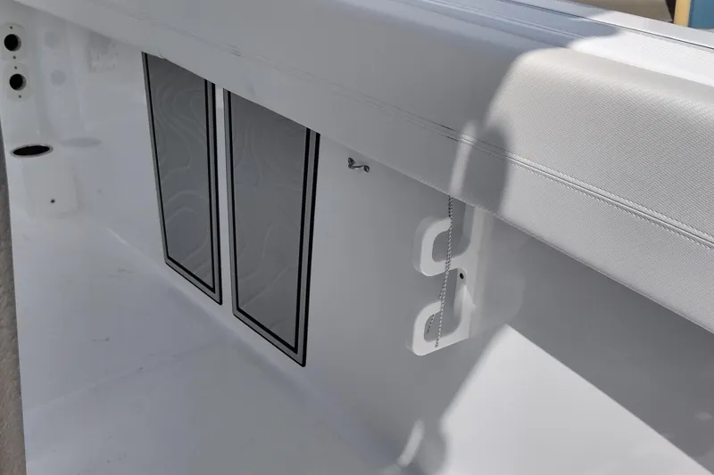 Slide: The Image of 2024 Wellcraft 223 Fisherman boat interior detail with storage compartments and seating. - 27