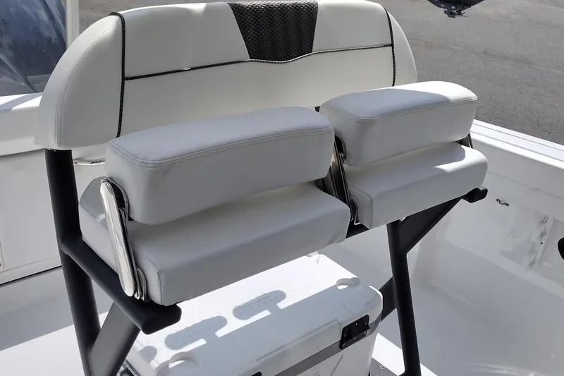 Slide: The Image of 2024 Wellcraft 223 Fisherman boat seating with cushioned backrests and armrests. - 20