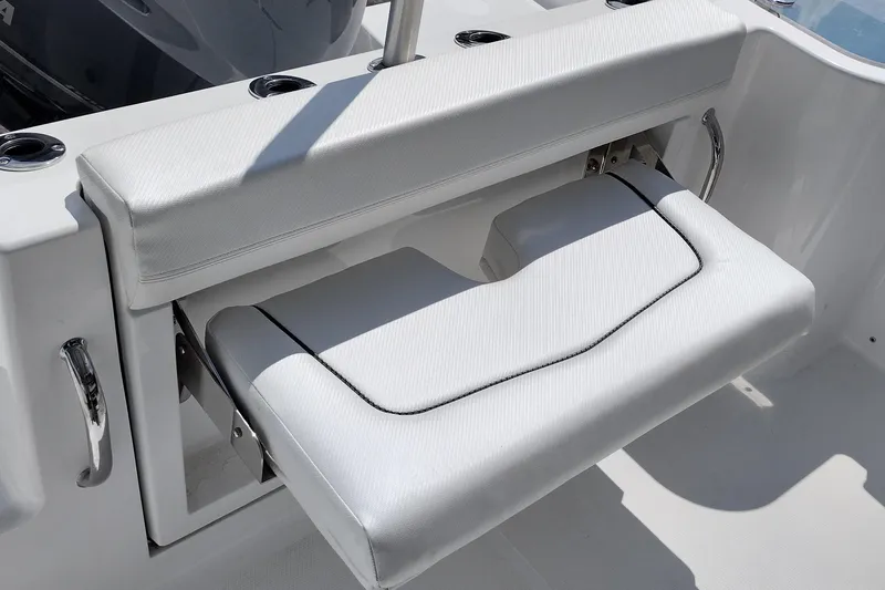 Slide: The Image of 2024 Wellcraft 223 Fisherman boat with foldable white cushioned seat. - 23