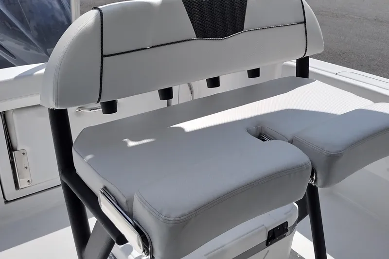 Slide: The Image of 2024 Wellcraft 223 Fisherman boat seat with white upholstery and black accents. - 21