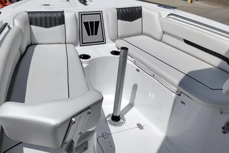 Slide: The Image of 2024 Wellcraft 223 Fisherman boat interior with white seating and modern design. - 15