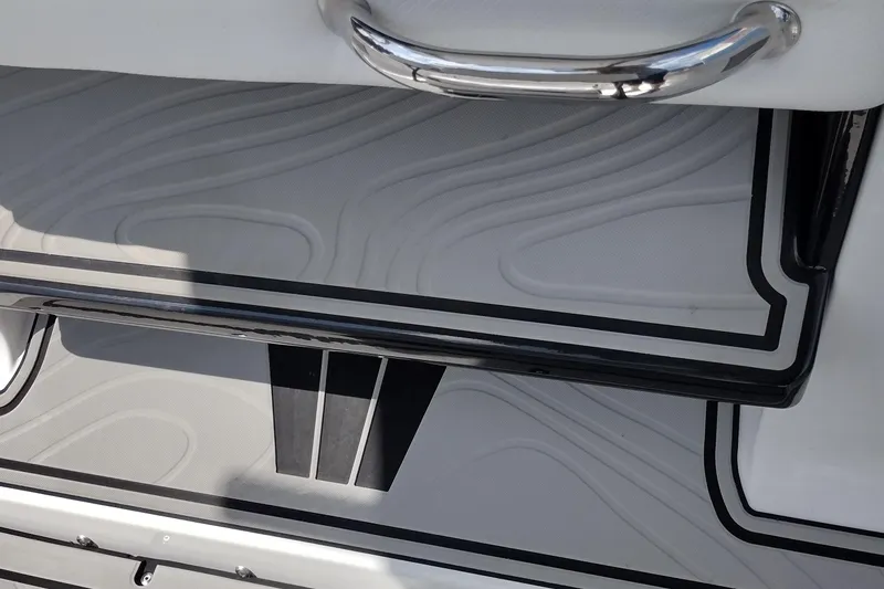 Slide: The Image of 2024 Wellcraft 223 Fisherman boat interior with sleek design and chrome handle. - 32
