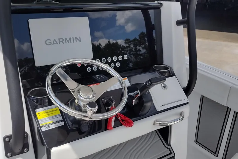 Slide: The Image of 2024 Wellcraft 223 Fisherman boat console with Garmin display and steering wheel. - 14