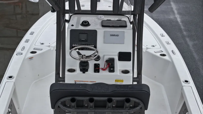 Slide: The Image of The image shows the cockpit of a Sea Pro 230 DLX boat with controls and instruments. - 5