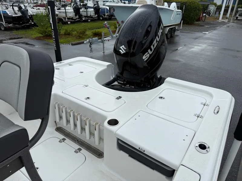 Slide: The Image of The image shows the stern of a Sea Pro 230 DLX boat with a Suzuki outboard motor. - 7