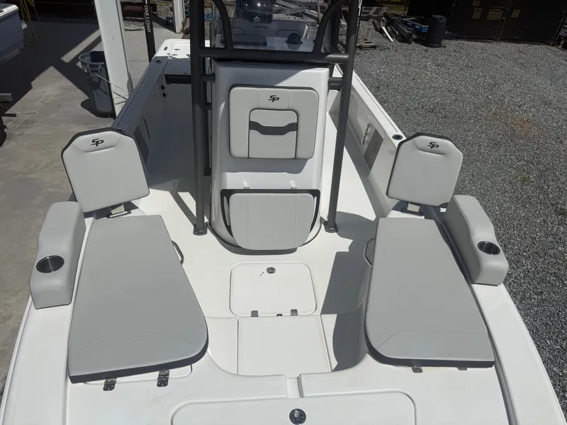 Slide: The Image of The image shows the cockpit of a Sea Pro 230 DLX boat with gray upholstery. - 7
