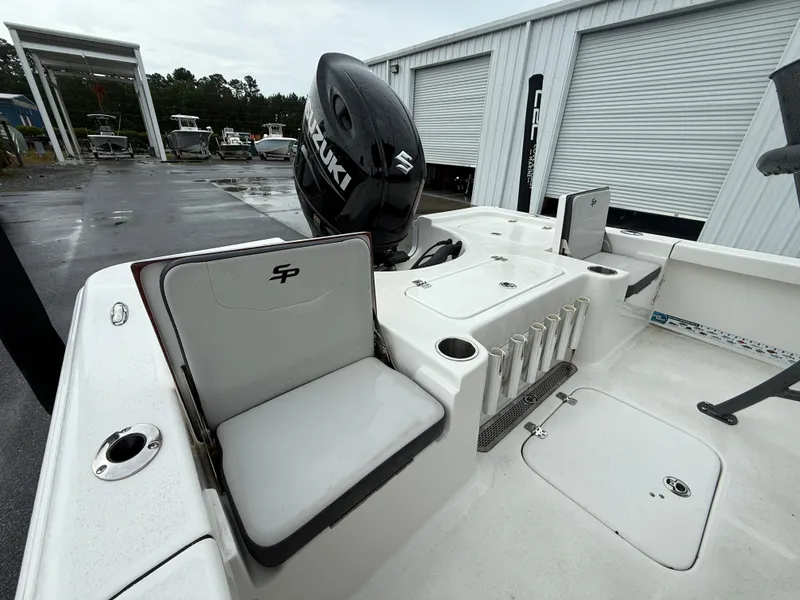 Slide: The Image of The image shows the stern of a Sea Pro 230 DLX boat with a Suzuki outboard motor. - 11