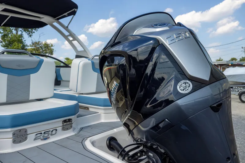 Slide: The Image of 2026 Chaparral 250 OSX boat with Yamaha engine, featuring sleek seating and modern design. - 22