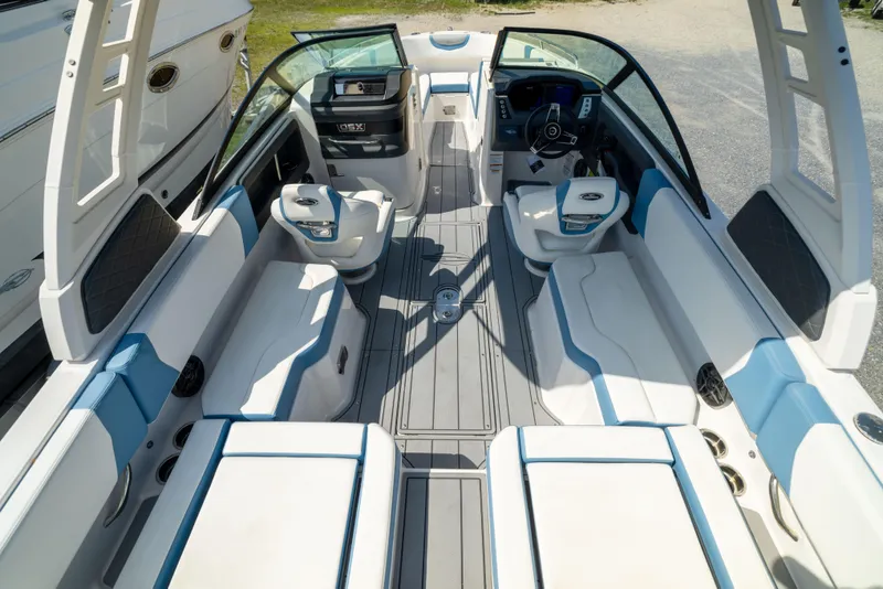 Slide: The Image of 2026 Chaparral 250 OSX boat interior with modern seating and sleek design. - 17