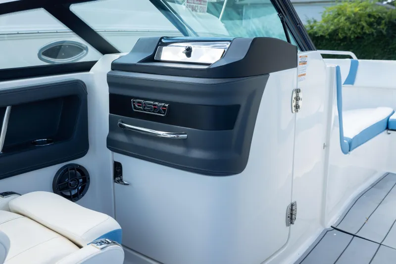 Slide: The Image of Interior view of 2026 Chaparral 250 OSX boat, featuring sleek design and modern amenities. - 12