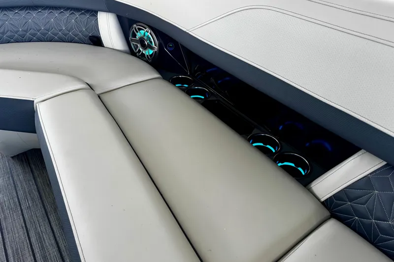 Slide: The Image of Luxurious seating and illuminated cup holders in 2026 Harris Grand Mariner 250 SLDH boat interior. - 22