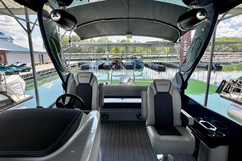 Slide: The Image of Interior view of 2026 Harris Grand Mariner 250 SLDH boat at marina dock. - 13