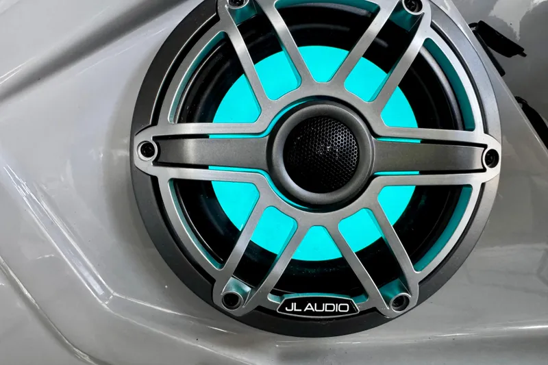 Slide: The Image of Close-up of JL Audio speaker with blue LED light on Harris Grand Mariner 250 SLDH, 2026 model. - 20