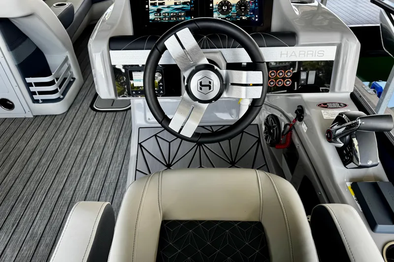 Slide: The Image of 2026 Harris Grand Mariner 250 SLDH helm with modern steering and control panel. - 18