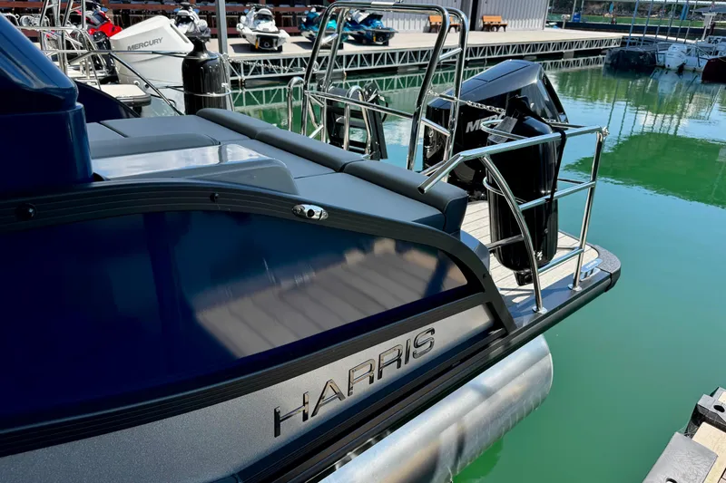 Slide: The Image of 2026 Harris Grand Mariner 250 SLDH pontoon boat docked at marina. - 8